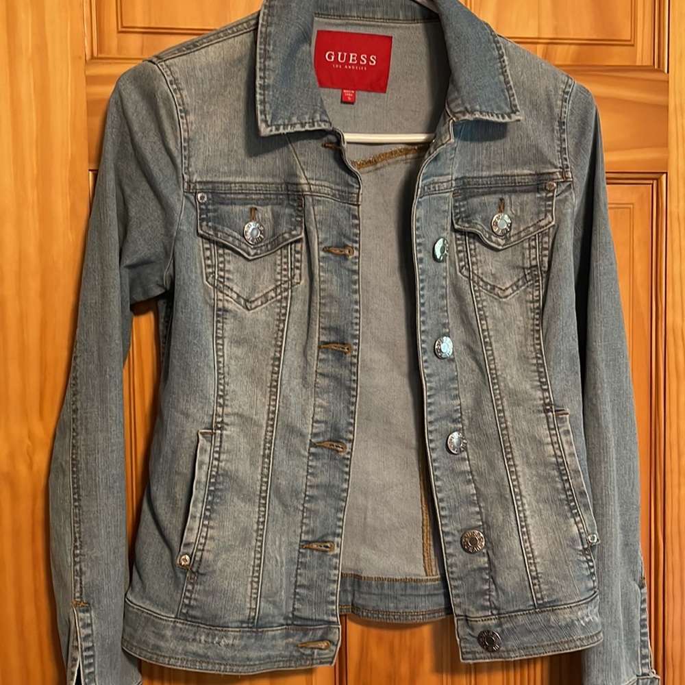Adorable Guess Jean jacket with distressed light blue material.